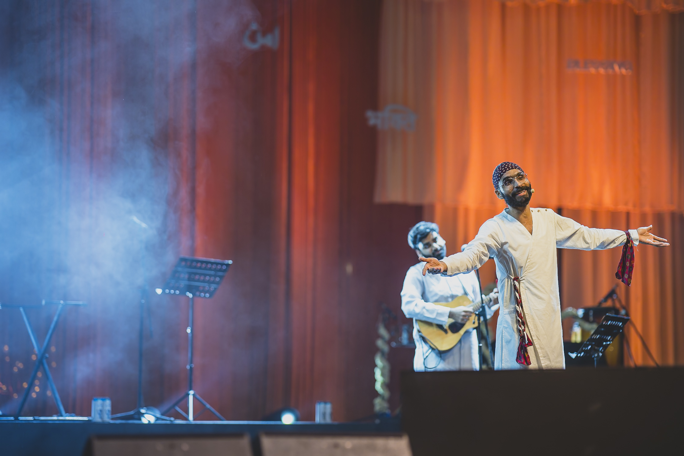 A Sufi artist singing and playing a string instrument