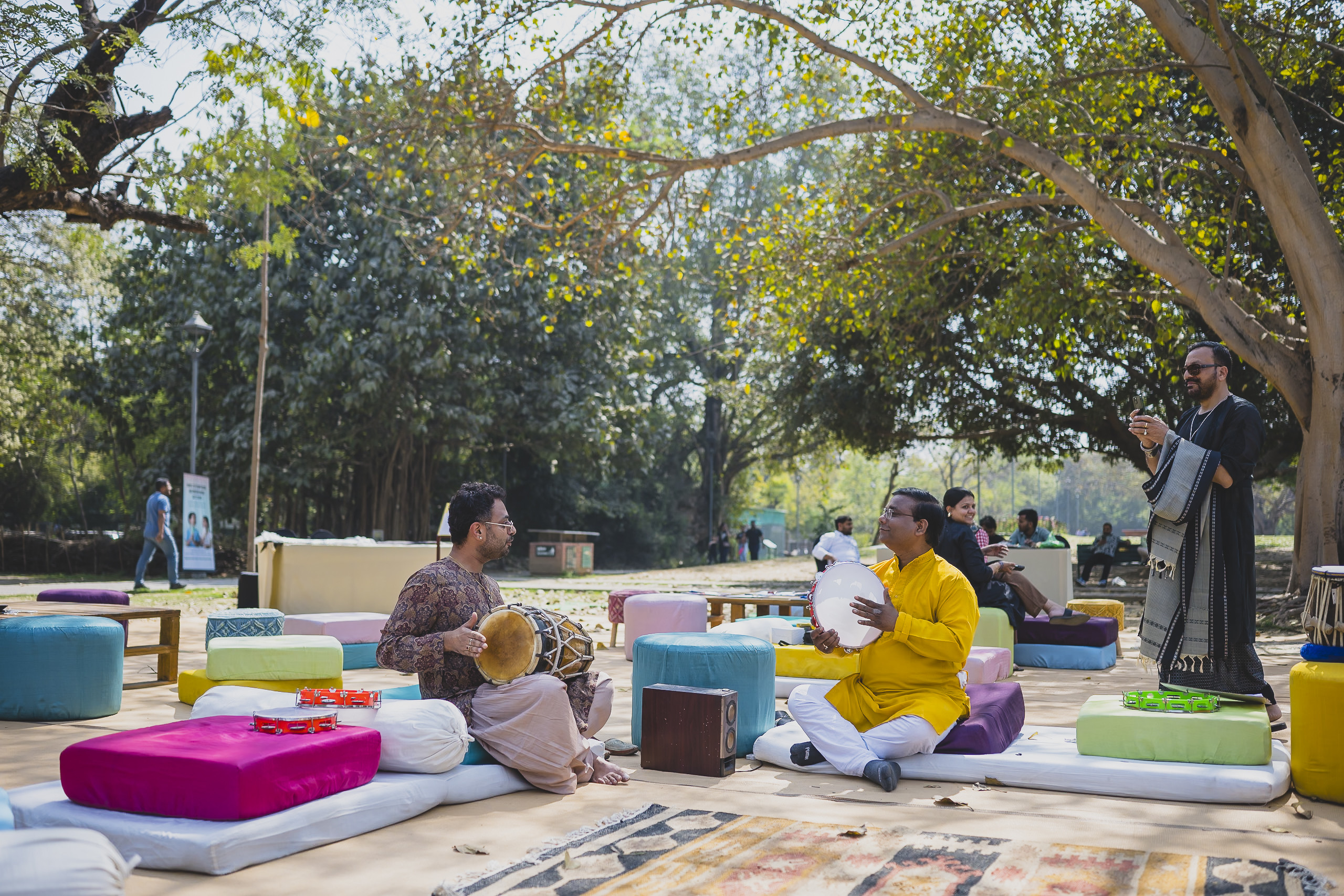 Musicians sharing a performance in an outdoor festival gathering